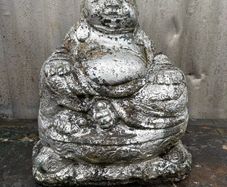 Reconstituted Silver stone Buddha garden statue.