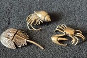 3 brass crabs,. Solid brass.