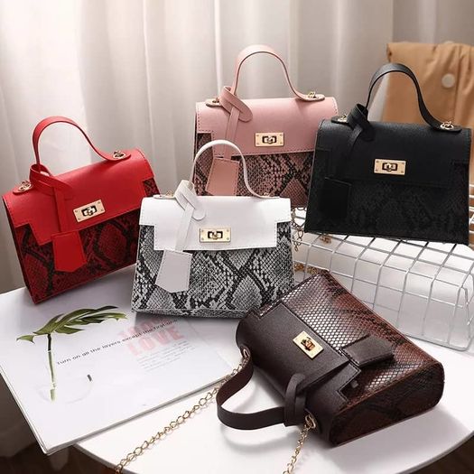 Black snakeskin twist lock bag