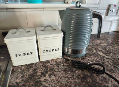 coffe and suger tines and kettle.