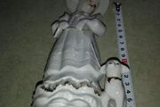 Lovely musical lady figurine with baby lamb.