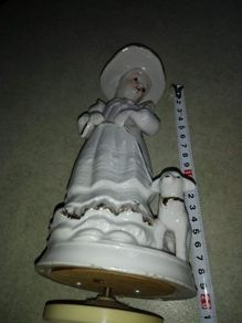 Lovely musical lady figurine with baby lamb.