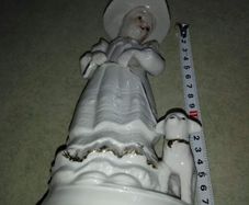 Lovely musical lady figurine with baby lamb.