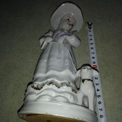 Lovely musical lady figurine with baby lamb.