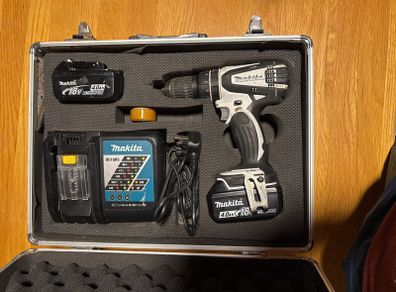 Set of Makita drill charger and 2 batteries