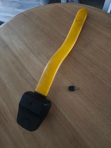 a steering wheel lock with a key