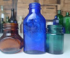 463 - Set of Three Beautiful Vintage Glass Decorative Collectible Bottles - Amber Eire Bovril, Cobalt Blue Magnesia and Turquoise Science Cream