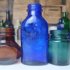 463 - Set of Three Beautiful Vintage Glass Decorative Collectible Bottles - Amber Eire Bovril, Cobalt Blue Magnesia and Turquoise Science Cream