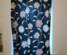 2 identical black floral curtains 180cm L and 114cm W