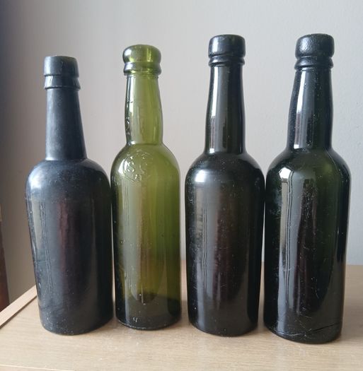 Lot of 4 vintage Guinness bottles