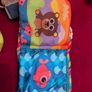 Baby sensory books and a rattle toy Image 5