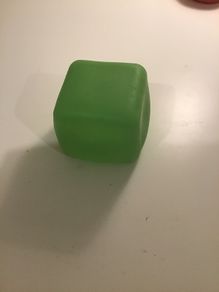 Green squishy glow in the dark cube