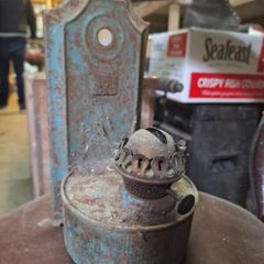 Vintage wall-mounted kerosene lamp