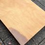 Solid wood dining table. Damage on corner as shown in photos. Image 7