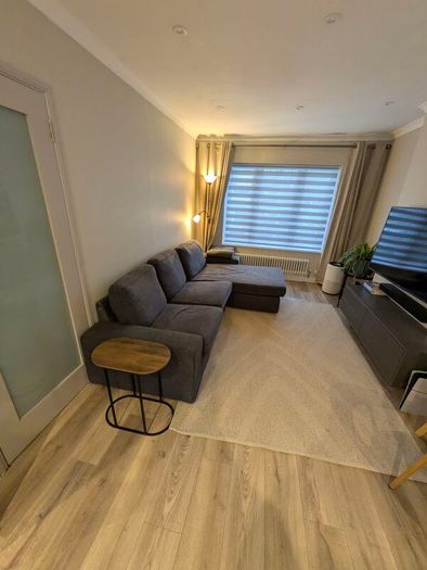 IKEA KIVIK 3-seater sofa with chaise in dark grey.