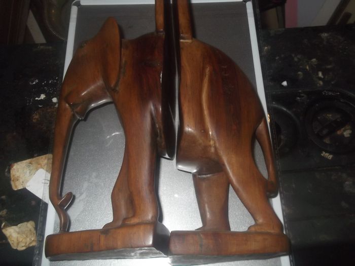 a pair of vintage wooden elephant bookends