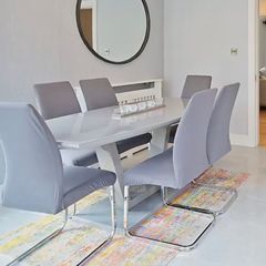 Glass-topped dining table with 6 chairs
