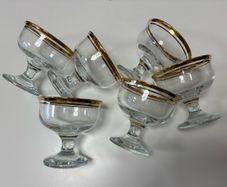 Set of six clear glass footed dessert dishes with gold-trimmed rims