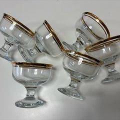 Set of six clear glass footed dessert dishes with gold-trimmed rims