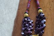 Vintage spectacular necklace made of wooden beads and medallion.