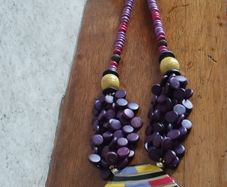 Vintage spectacular necklace made of wooden beads and medallion.