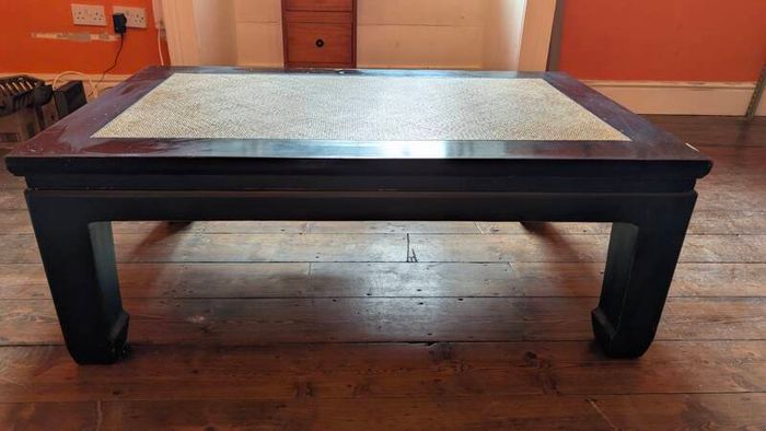 coffee table, black lacquered with rattan inset