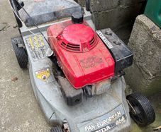 2 Petrol Lawnmowers - Free to take together