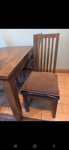 Wooden dining table and four chairs