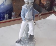 a lladro figure of a sailer boy