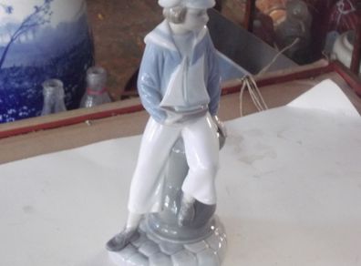 a lladro figure of a sailer boy