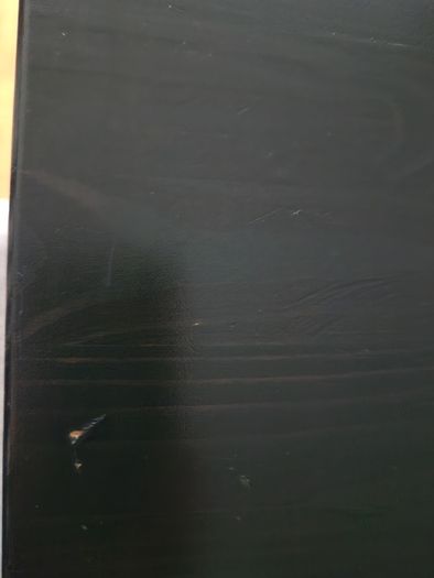 Black dining table with four chairs