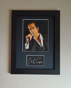 Nick Cave autograph mounted In a frame