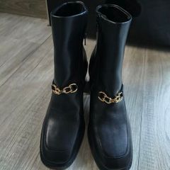 Rita  Ora black boots
