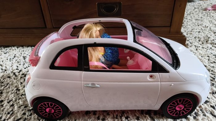 Barbie with car.