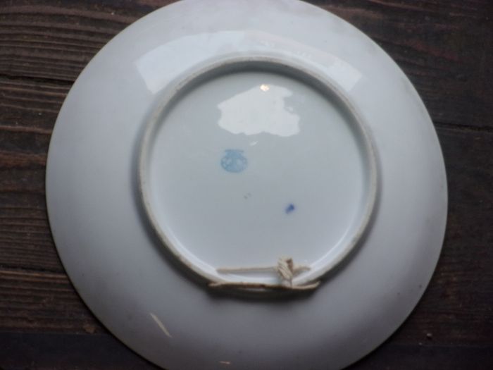 a large antique round plaque signed.kauffman