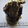The Hotei (Laughing Buddha) figurine is a talisman of wealth and good fortune. Image 7