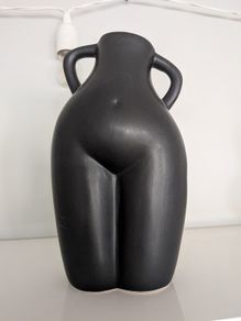 Large black torso figurine