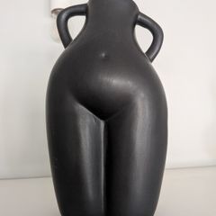Large black torso figurine