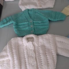 New baby cardigans size 0/3months .2 blue one green one yellow two white .Also two blue hats all new 25 euro