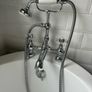 free standing bath with taps and and hose Image 2