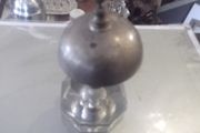 a antique counter bell with a cut glass base