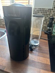 Nespresso coffee machine with box of pods