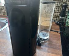 Nespresso coffee machine with box of pods