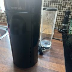 Nespresso coffee machine with box of pods