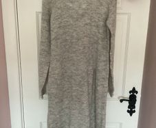 jumper boutique brand jumper /jumper dress size small with unusual side slit