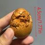 Carved wooden dragon hatching from an egg. Image 3