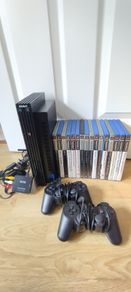 ps2 console with 2 controllers and 14 games
