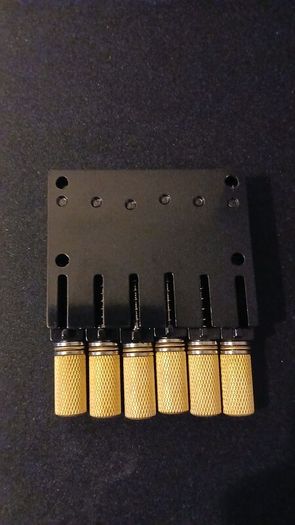 Headless guitar fixed bridge