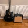 guitar with amp. It has an auto tuner unwanted gift Image 2