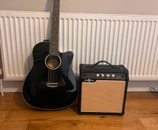 guitar with amp. It has an auto tuner unwanted gift